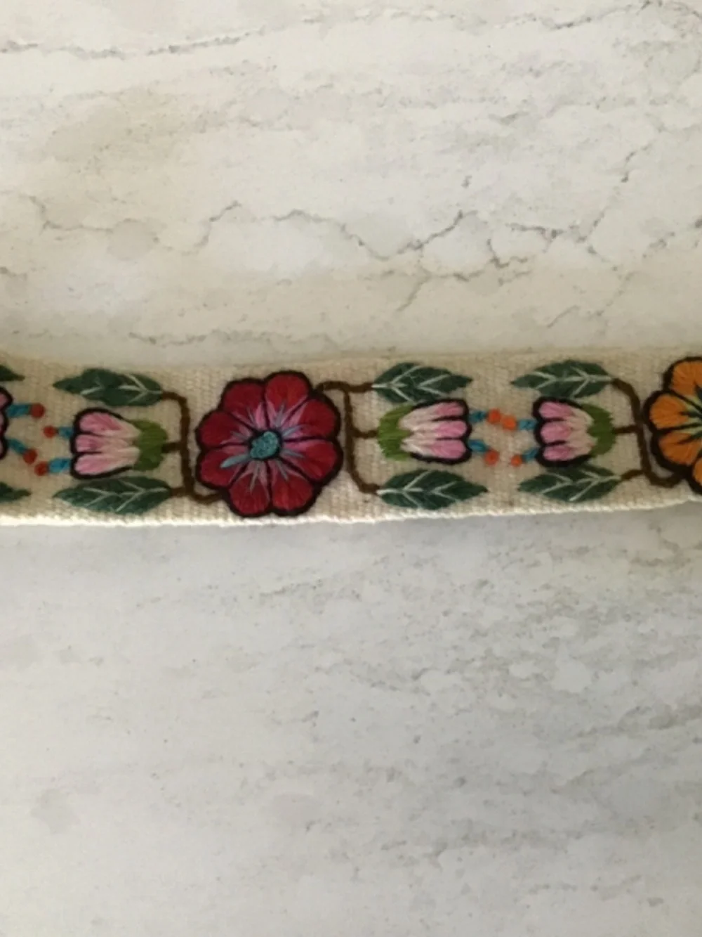 Embroidered belt with Pom poms